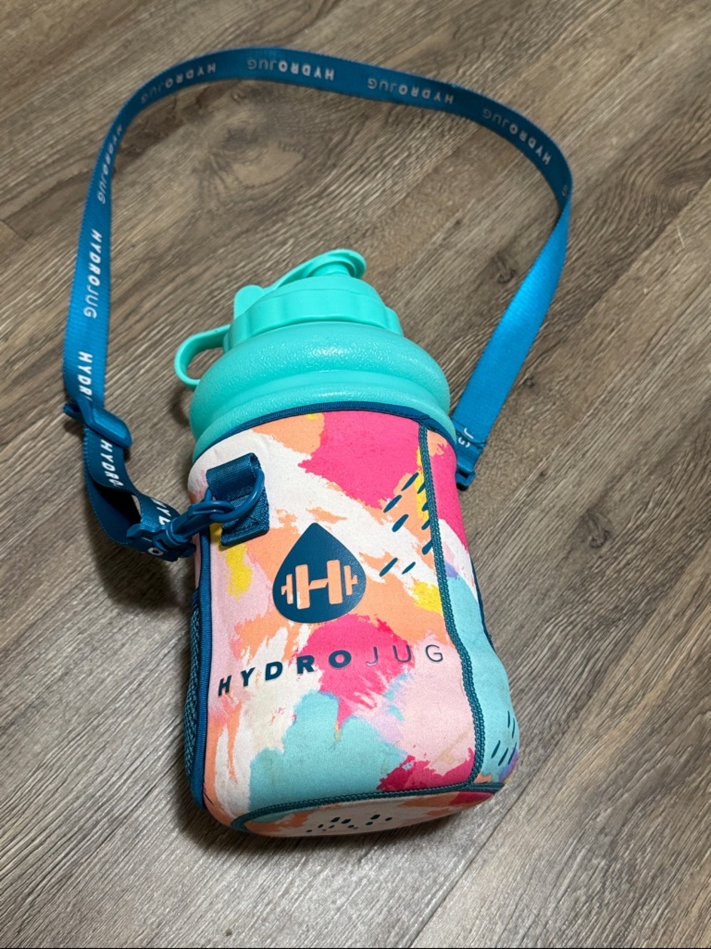 HydroJug Multicolor Water Bottle with Teal Lid and Blue Strap